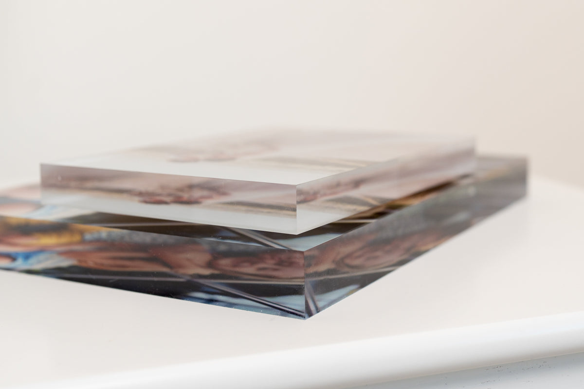 Top view of stacked clear acrylic photo blocks with a printed image panel.