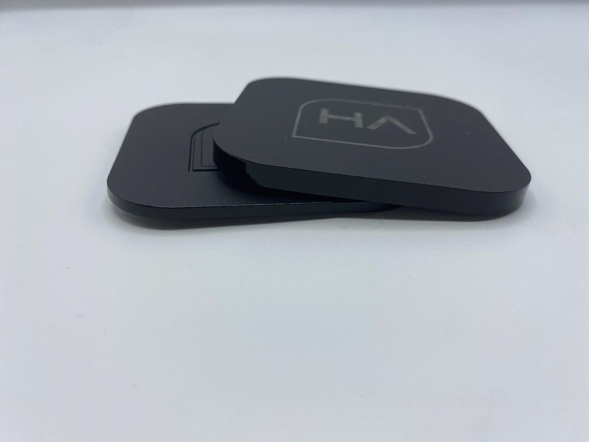 Stacked glossy black cast acrylic pieces with HA logo on top, rounded corners