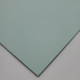 Pastel green matte acrylic sheet corner showing beveled edge and double-sided surface