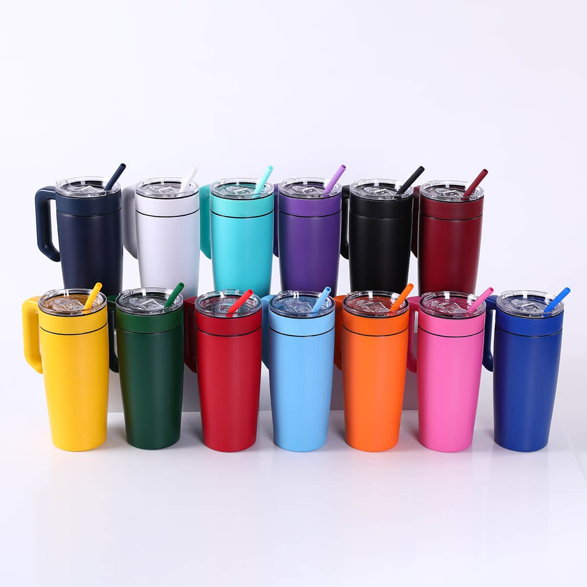 Set of MakerFlo twist-on tumbler handles on tumblers in mixed colors