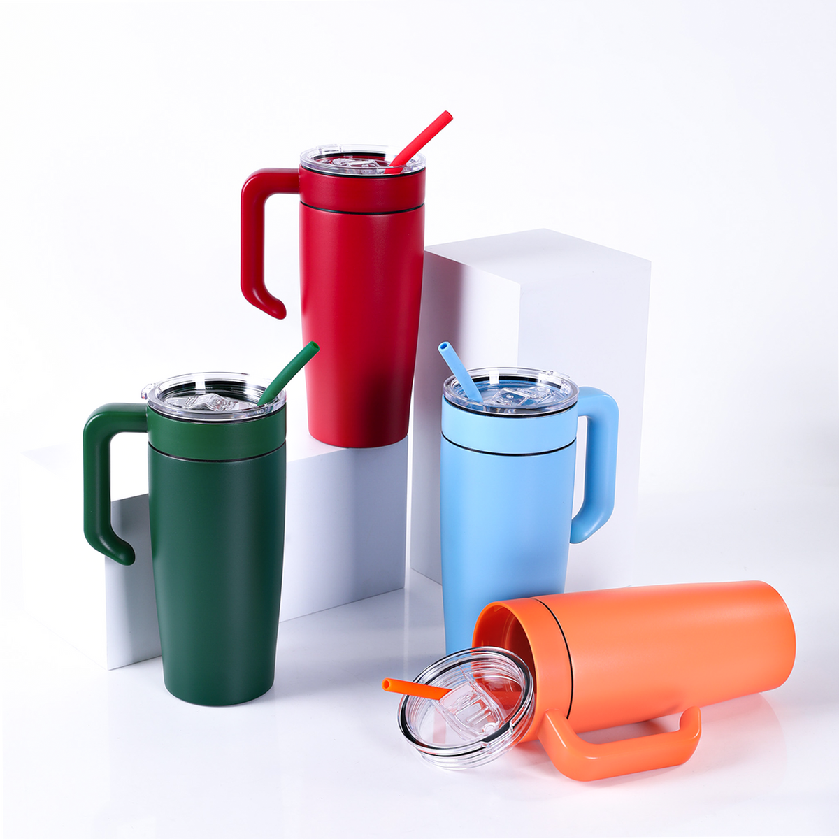 MakerFlo 20oz stainless tumbler set: red, green, and light blue with lids and straws