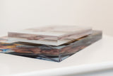 Top view of stacked clear acrylic photo blocks with a printed image panel.