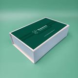 Light blue rigid magnetic closure box with hinged lid, dark green insert-style print.