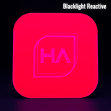 Blacklight reactive hot pink acrylic sheet with HA logo glow, rounded square