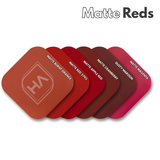 Matte red acrylic swatch samples, stacked rounded squares in multiple red tones