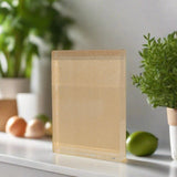 Clear acrylic face-mount panel block with blank frosted insert, standing on ledge