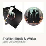 Laser-cut wooden witch house ornament design on dark flat boards
