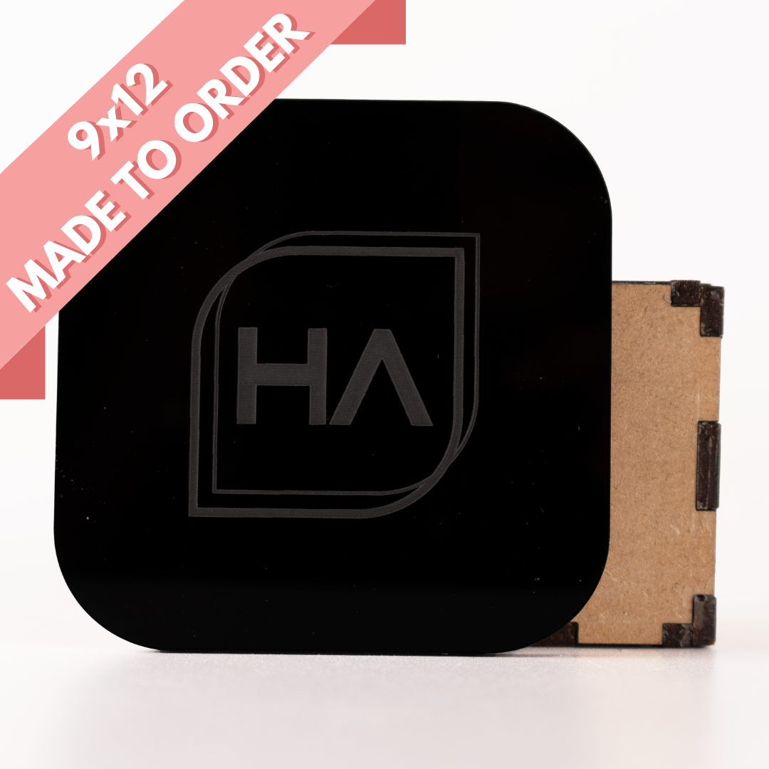 Glossy black cast acrylic sheet with etched HA logo, rounded-square front view