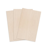 Set of light wood sample sheets with subtle grain, stacked for display