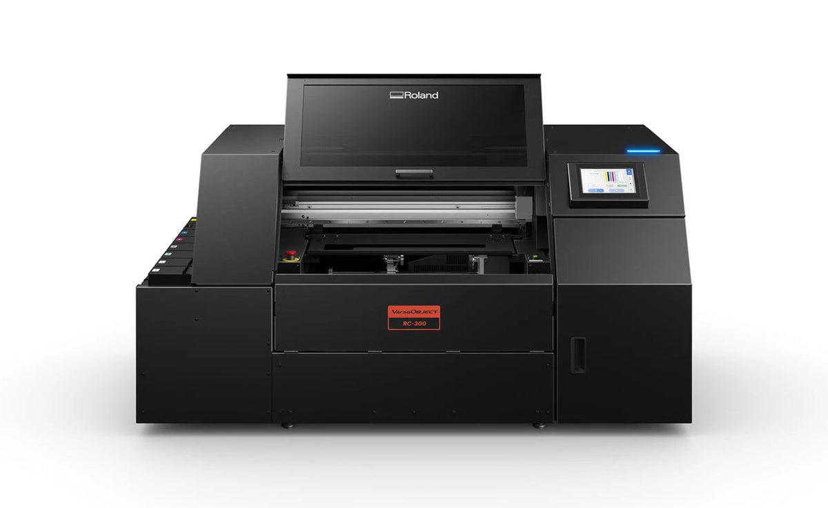 A Roland brand industrial laser cutter or engraver machine in matte black, shown from a front-three-quarter angle on a clean white background.