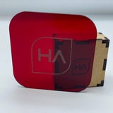 Glossy translucent ruby red acrylic sheet side view, rounded corners, mounted on backing