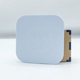 Cornflower blue cast acrylic sheet sample in light blue, side view on backing board