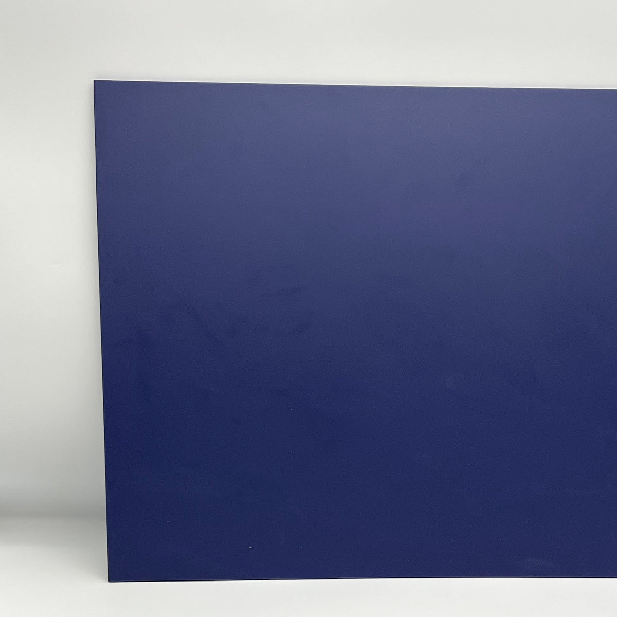 Dark navy blue matte cast acrylic sheet, flat with square corners