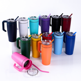 Group of colored 20oz stainless tumblers with clear lids and straws